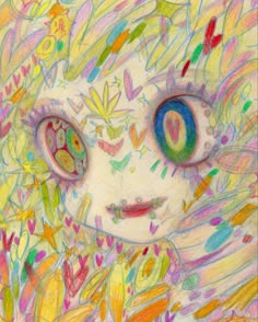 a child's drawing with colored crayons on the face and eyes,