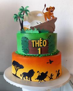 the lion king birthday cake is decorated with fondant and edible decorations, including an animal scene