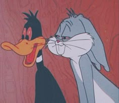 two cartoon characters are kissing each other with their mouths open and tongues out in front of them