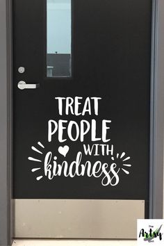 a door with the words treat people with kindness painted on it