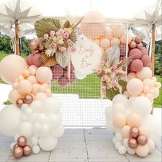 some balloons and flowers are on the ground