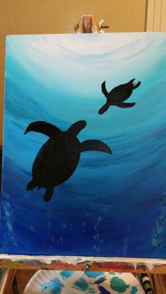 a painting of two sea turtles in the ocean