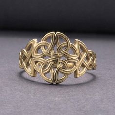 Celtic Ornament Gold Ring 💎 Traditional Celtic knotwork 💎 Five-fold knot of nature 💎 Elements, seasons, cardinal directions 💎 Handcrafted in fine gold What does this jewelry represent? Knotwork was used by both the Vikings and the Celts. It uses unending lines to symbolize the endlessness of the universe and the interconnectedness of all things. The Celtic five-fold knot featured on this ring represents the natural world: the four seasons, the four directions, and the four elements. It is a Triquetra Pendant, Celtic Druids, Celtic Ornaments, Paw Ring, Cardinal Directions, Nature Elements, Celtic Knot Ring, Viking Ring, Celtic Knotwork