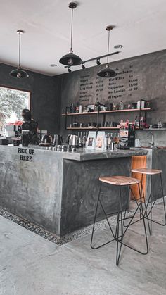 a bar with two stools in front of it