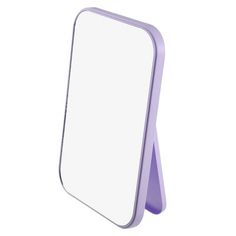 a mirror that is sitting on top of a white surface with a purple stand in front of it