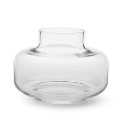 a clear glass vase sitting on top of a white table