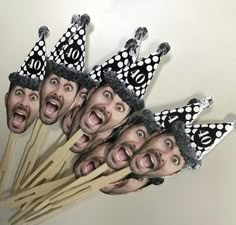 a bunch of sticks with some funny faces on them