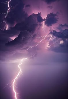 a lightning storm is seen over the ocean