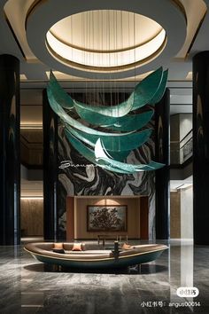 the lobby is decorated in black and white with an artistic ceiling light hanging over it