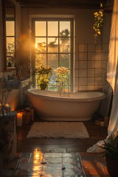 a bathroom with a bathtub, rugs and candles on the floor in front of an open window