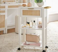 a small white table with cosmetics on it