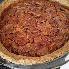 a pecan pie sitting on top of a stove