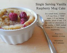 a bowl of raspberry mug cake with a spoon next to it on a table