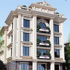 a large white building with many windows and balconies