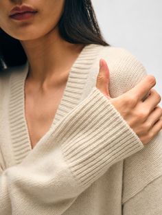 Our luxe knitwear is made from the highest quality cashmere, which ensures each piece fits perfectly and will remain in your closet for years. This boyfriend-style cardigan is crafted from three ends of cashmere that’s insulating and drapes beautifully. Wide, rib trims and handy patch pockets complete the minimal design. Reach for it in place of a jacket for morning coffee runs or cold days in the office. Details Relaxed fit. Long sleeve. Length in size small is 27 1/4". 100% Cashmere. Dry clean Elegant Soft Knit Cashmere V-neck Sweater, Cream Cashmere V-neck Sweater For Winter, Winter Cashmere V-neck Sweater For Layering, Elegant Beige Cashmere V-neck Sweater, Cream Cashmere V-neck Sweater, Chic Cashmere V-neck Sweater For Winter, Classic V-neck Sweater Coat For Layering, Classic Cashmere V-neck Sweater In Soft Knit, Classic Cashmere V-neck Sweater For Fall