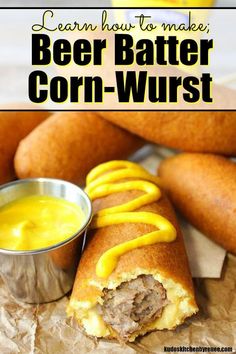 beer batter corn - wurst with mustard sauce on top and in the background, there is