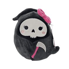 a black and white stuffed animal with a pink bow on it's head, holding an ax