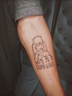 a person with a simpsons tattoo on their arm