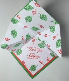 an origami folded thank you card with leaves on it