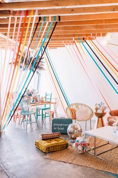 the instagram page on instagram shows an image of a room with colorful ribbons hanging from