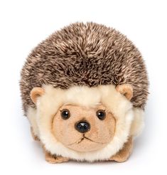 a hedgehog stuffed animal sitting on top of a white surface