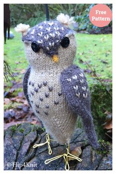 a knitted owl sitting on top of a rock