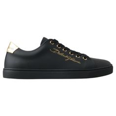 Step Into Luxury With These Stunning, Brand New Classic Sneakers From The Iconic Fashion House Dolce & Gabbana. Crafted From Premium 100% Leather In A Sleek Black With Gold Accents, These Shoes Are Not Just A Statement Of Style, But A Testament To Italian Craftsmanship. The Durable Rubber Sole Ensures Comfort And Longevity, While The Distinctive Logo Detail Adds An Exclusive Touch To Your Every Step. Elegance Meets Street Style With These Luxurious Sneakers, Made In Italy. Material: 100% Leather Luxury Leather Sneakers With Metallic Logo, Luxury Calf Leather Sneakers With Logo Plaque, Luxury Lace-up Sneakers, Luxury Calf Leather Sneakers, Luxury Calf Leather Sneakers For Formal Occasions, Luxury Sneakers With Laces, Designer Black Sneakers With Logo Plaque, Elegant Low-top Calf Leather Sneakers, Luxury Formal Sneakers With Round Toe