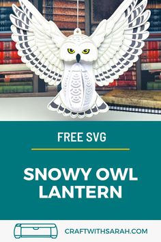 an owl ornament hanging from a book shelf with the text free svg snowy owl lantern