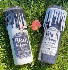 two black and white hair dyes sitting in the grass