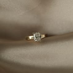 an engagement ring with a square cut diamond