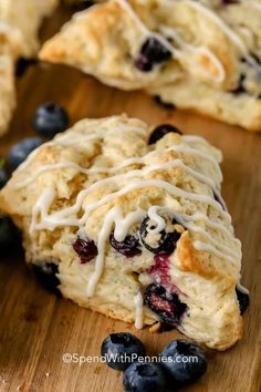 blueberry scones with icing on a cutting board