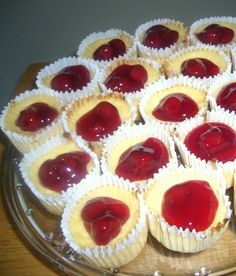 a platter filled with cupcakes covered in jelly