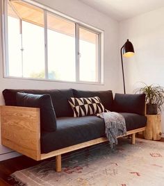 a living room with a couch and rug