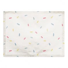 a white napkin with colorful sprinkles on it