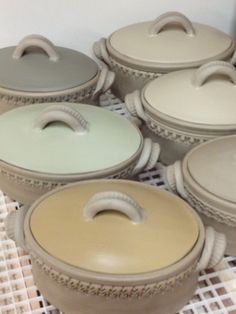 several pots and pans sitting on top of a table