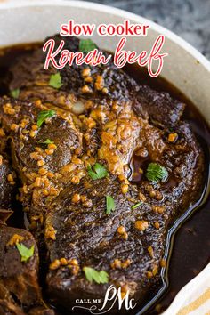 slow cooker korean beef recipe in a bowl with garnishes on top