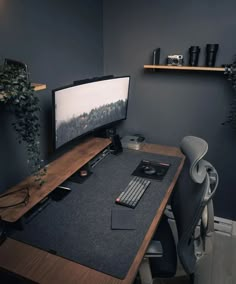 a computer desk with a monitor and keyboard on it