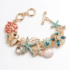 Only One In Stock. Rhinestones In Clear, Blue And Mint. Bright Gold Tone Metal. Painted Enamel Detailing. Pretty Detail. Toggle Bracelet Has 2 Adjustments. Bracelet Can Be Worn At 7.5 Inches Or At 8.5 Inches. Sea Bracelet, Ocean Inspired Jewelry, Slap Bracelets, Gold Charm Bracelet, Sea Theme, Toggle Bracelet