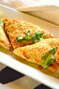 baked chicken curry puffs on a white plate