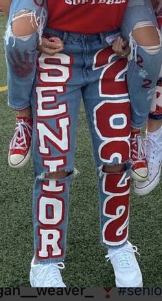 Class Of 23 Jeans, Class Of 2024 Painted Jeans, Class Of 23 Senior Pants, Senior Jeans Orange And Blue, Cute Senior Pants Ideas, Senior Class Pants, Senior Denim Jeans, Senior Pants Aesthetic, Senior Jeans Red And White