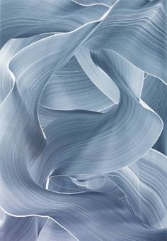 an abstract blue and white background with wavy lines