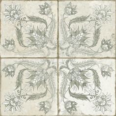 four tiles with flowers and leaves on them