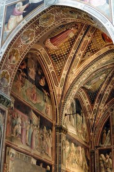 an ornate cathedral with paintings on the walls