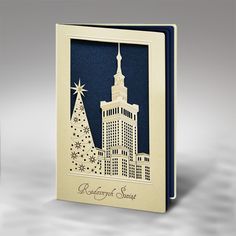 a card with a christmas tree and building in the background