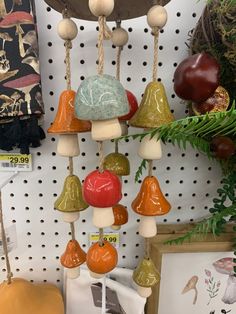 a bunch of bells that are hanging on a wall