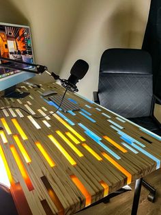 a computer desk made out of wooden planks