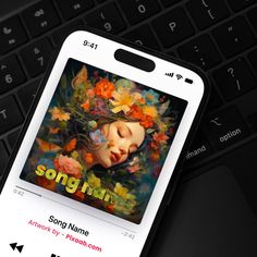 an mp3 player with the title song rain on it's screen next to a keyboard