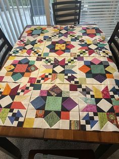 a table with a quilt on top of it