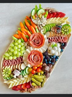 a platter filled with fruits and vegetables