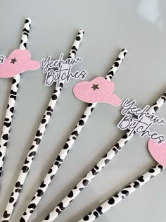 six valentine's day straws with black and white polka dots